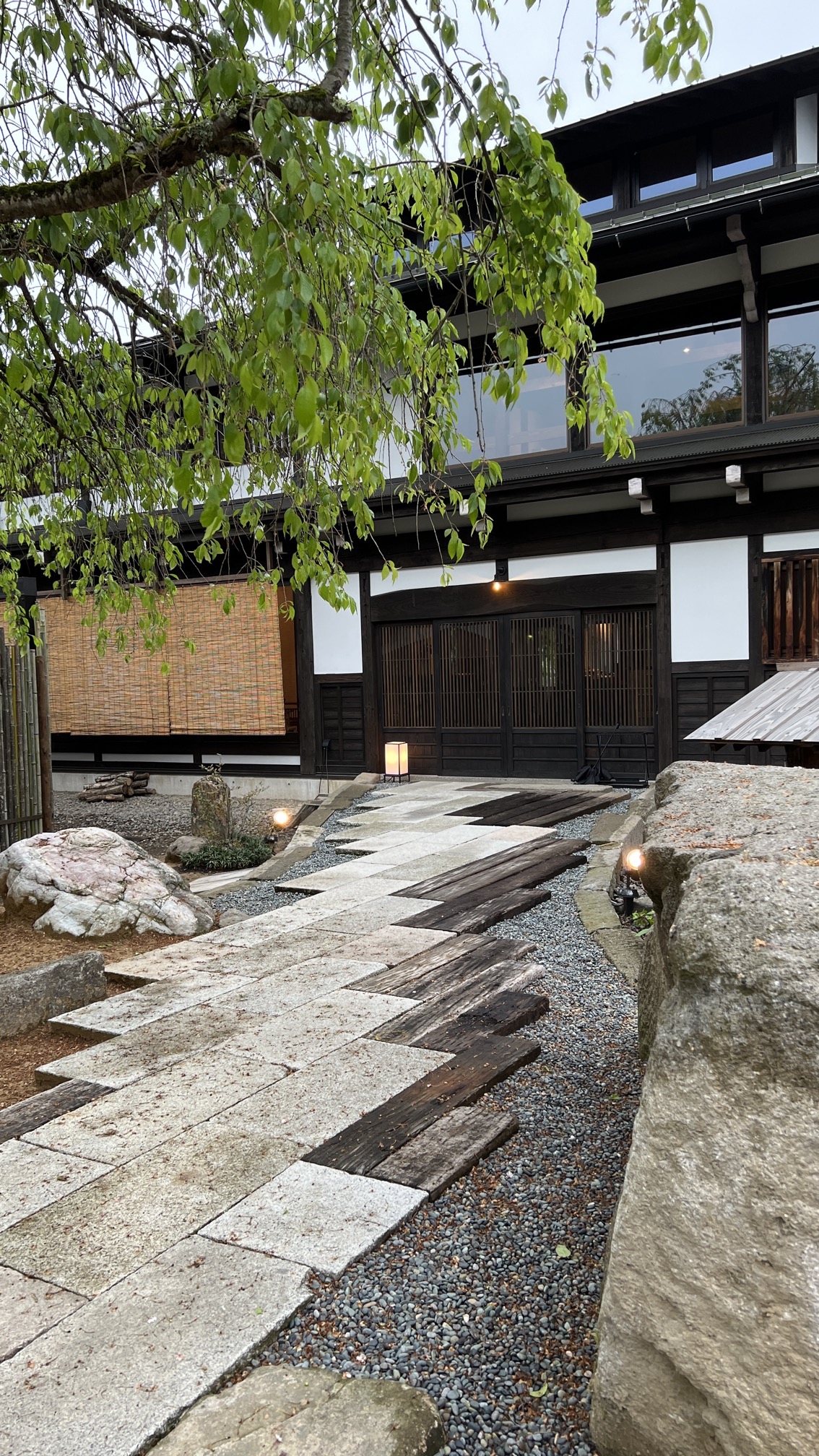 Private forest onsen with wooden deck overlooking mountain valley, Kanazawa
