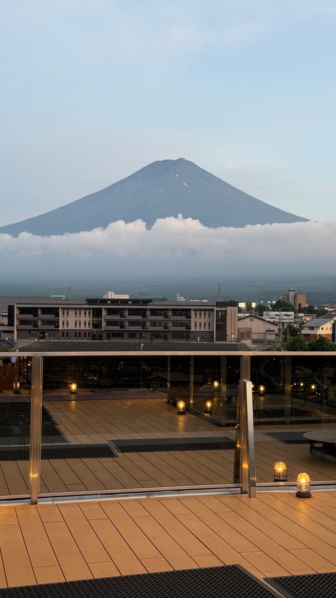 Mount Fuji at dawn from the Ubuya ryokan terrace, lanterns still glowing