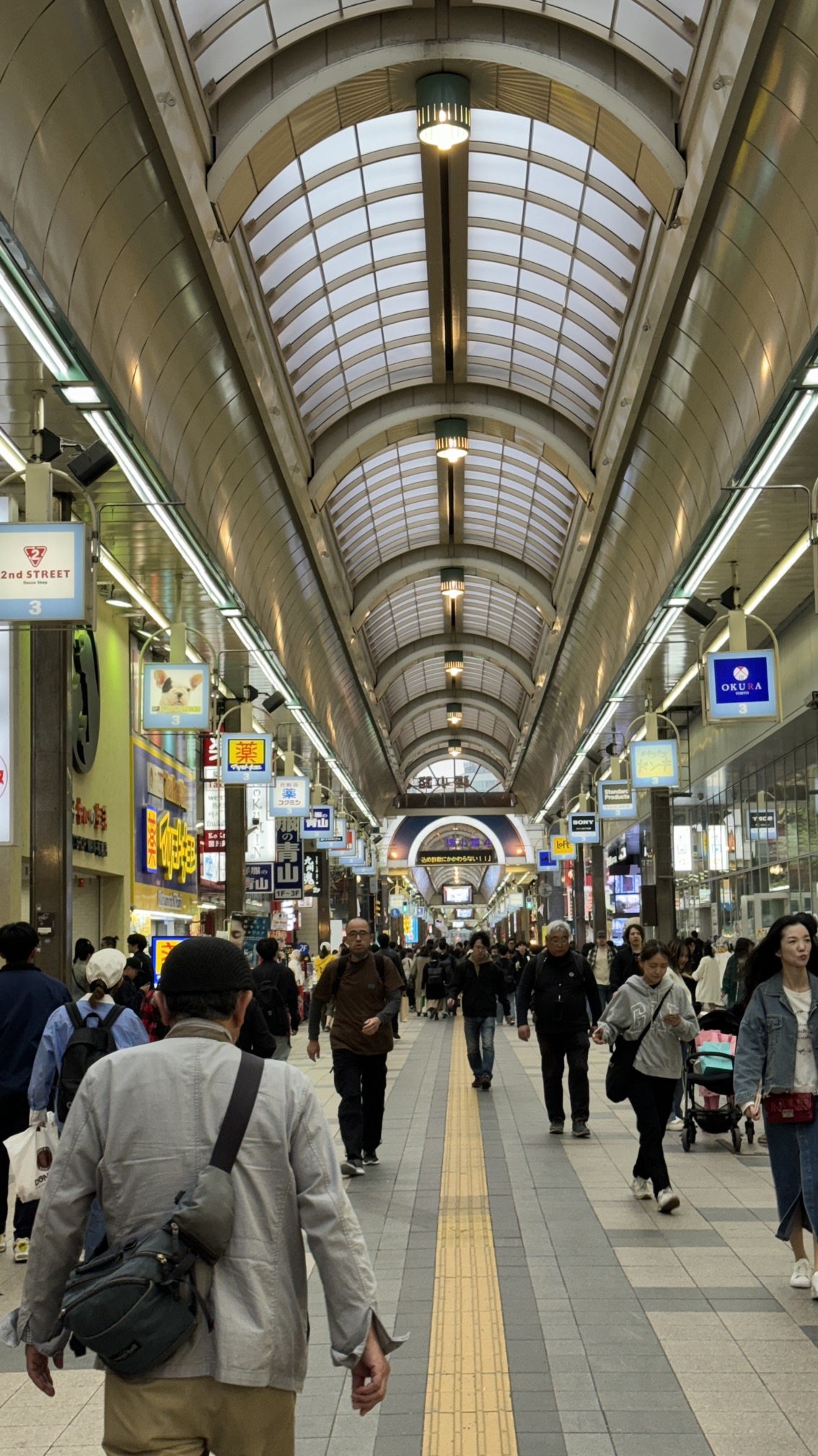 Indoor shopping arcade with covered corridor and storefronts, Sapporo