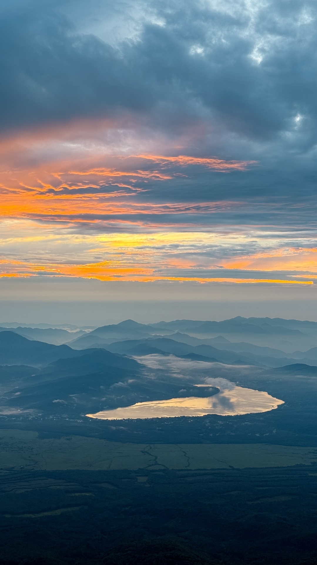 Sunrise glowing above Lake Sai and the sea of clouds from Mount Fuji
