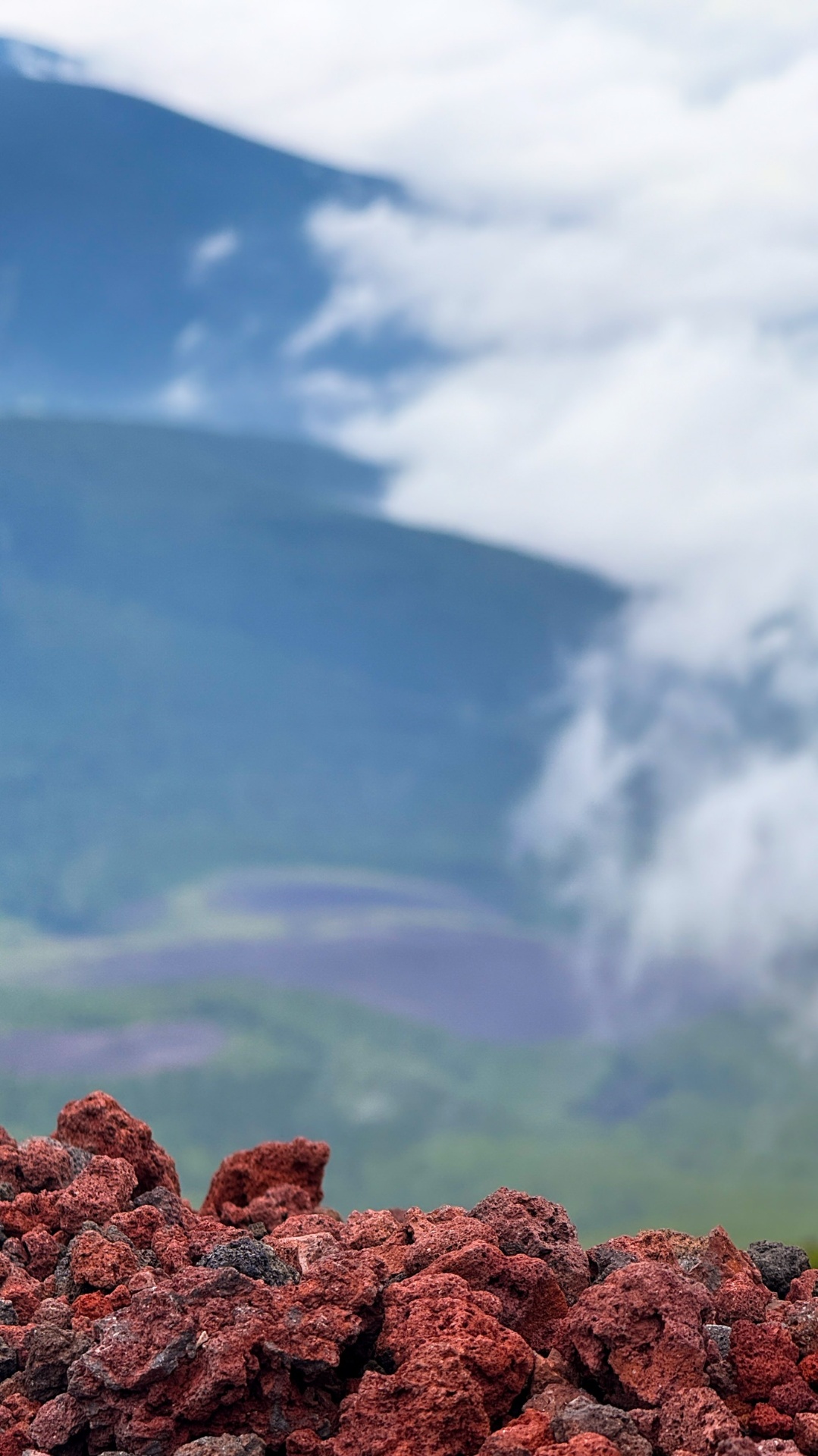 Hikers descending Mount Fuji in single file