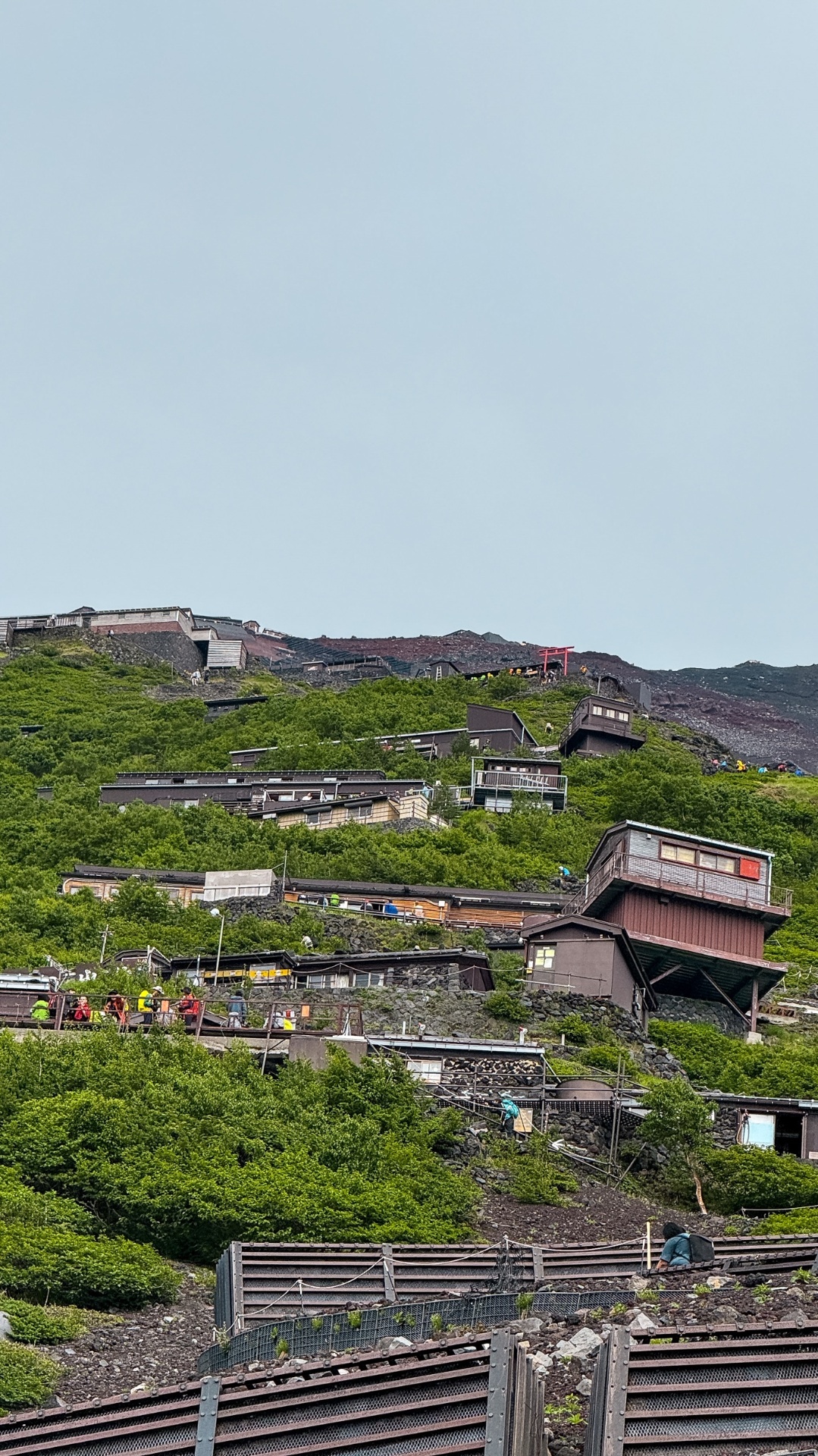 Mountain huts clinging to the volcanic slope along the Yoshida Trail