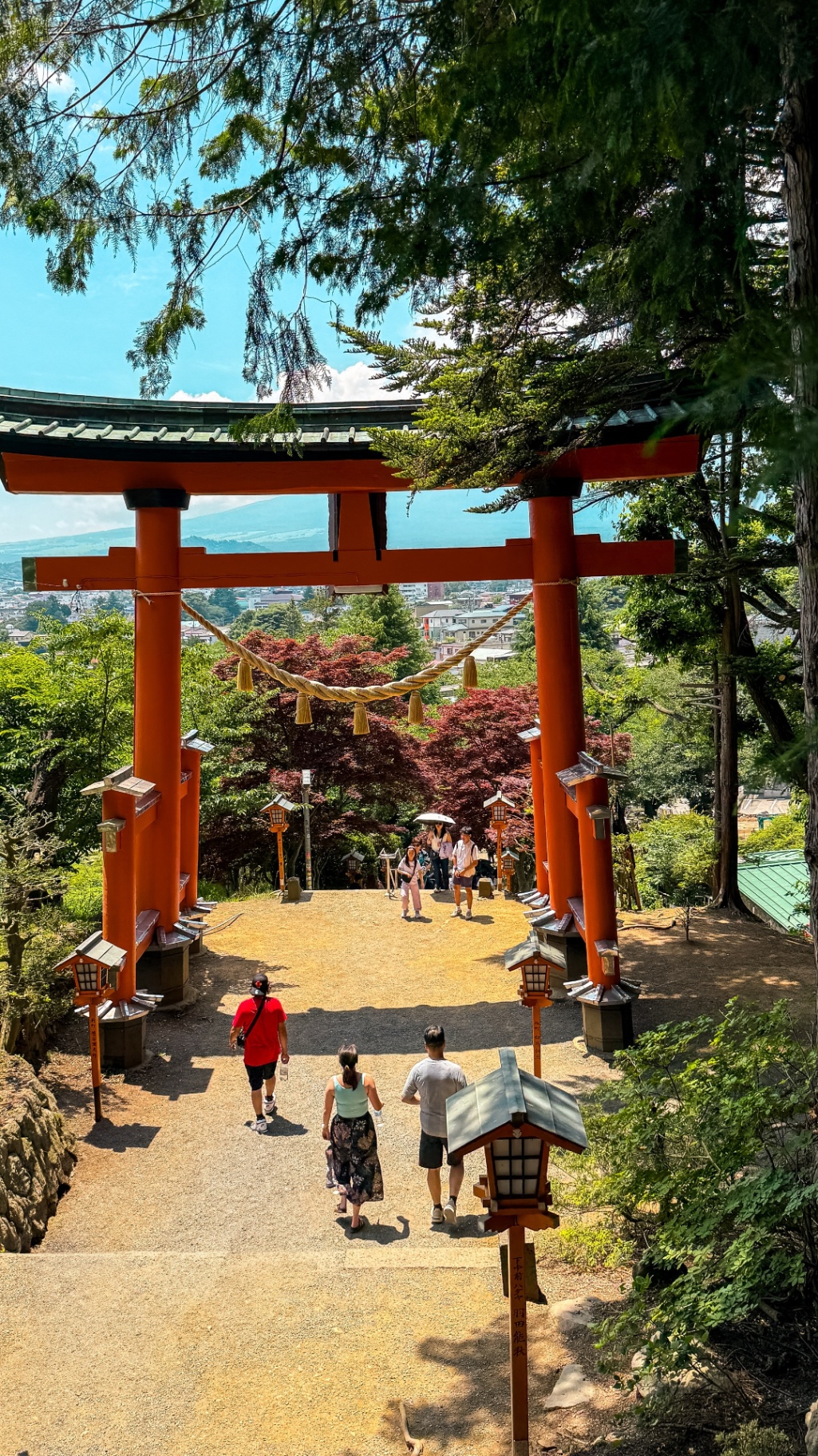 Large red torii gate at the entrance to Arakura Sengen Shrine