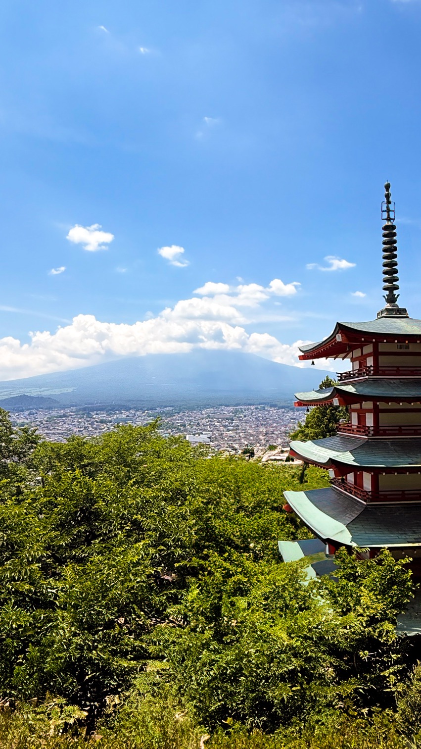 Chureito Pagoda with Mount Fuji rising in the distance above Fujiyoshida town