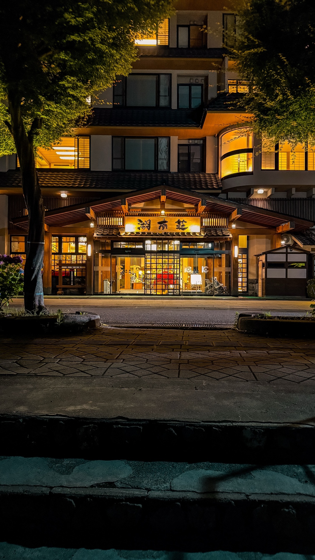 Traditional Japanese ryokan entrance in Kawaguchiko lit up at night