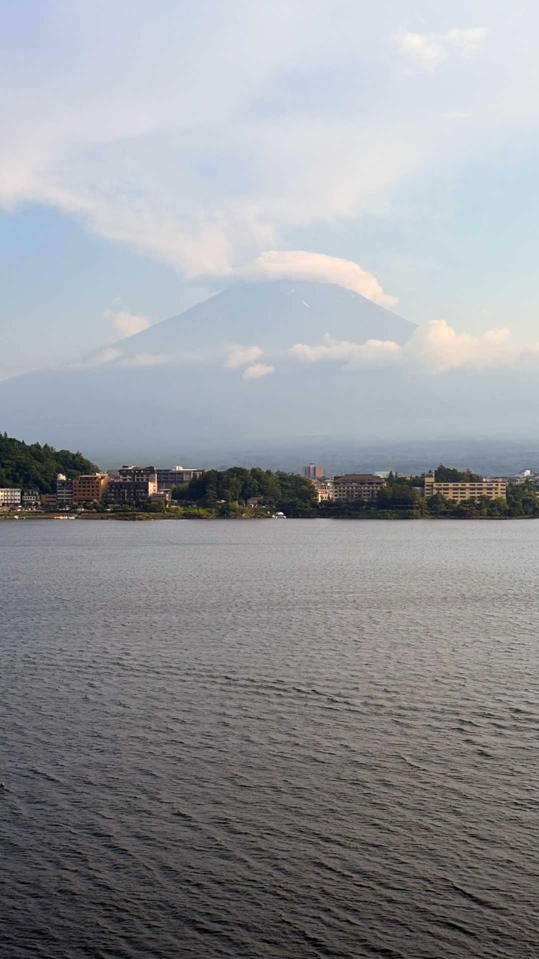 Mount Fuji with cloud cap rising above Lake Kawaguchiko
